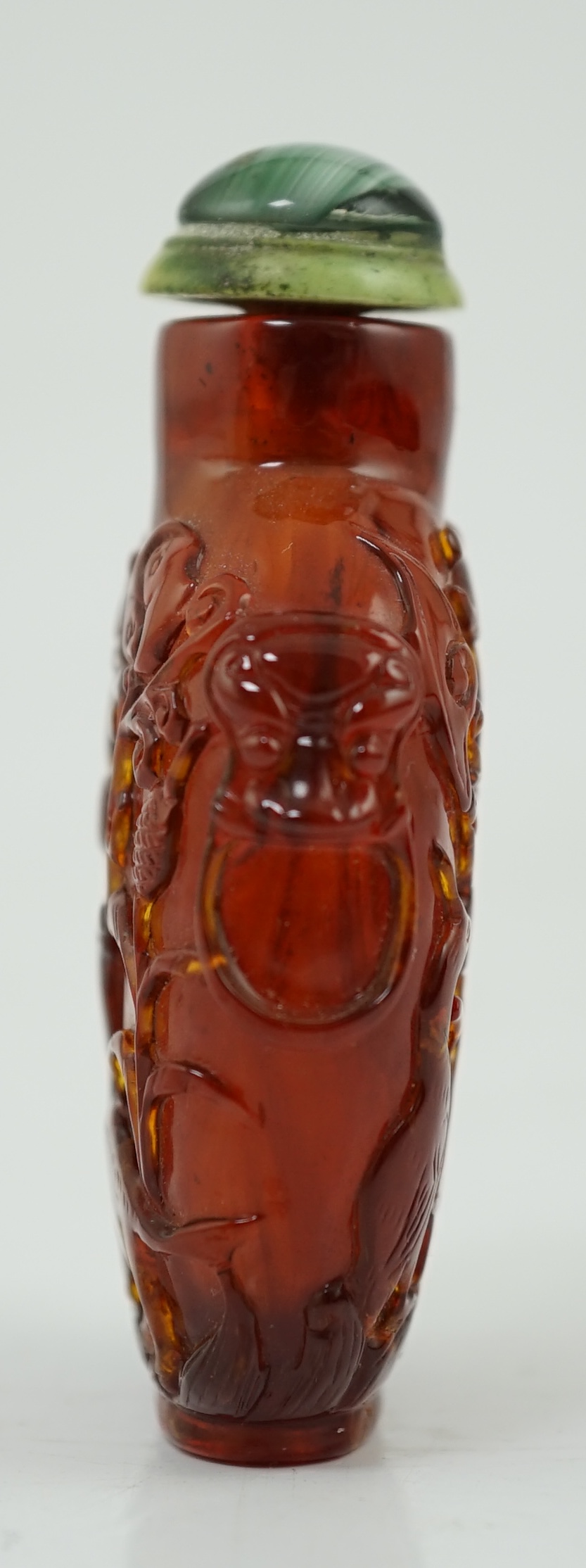A Chinese carved amber snuff bottle, 19th century